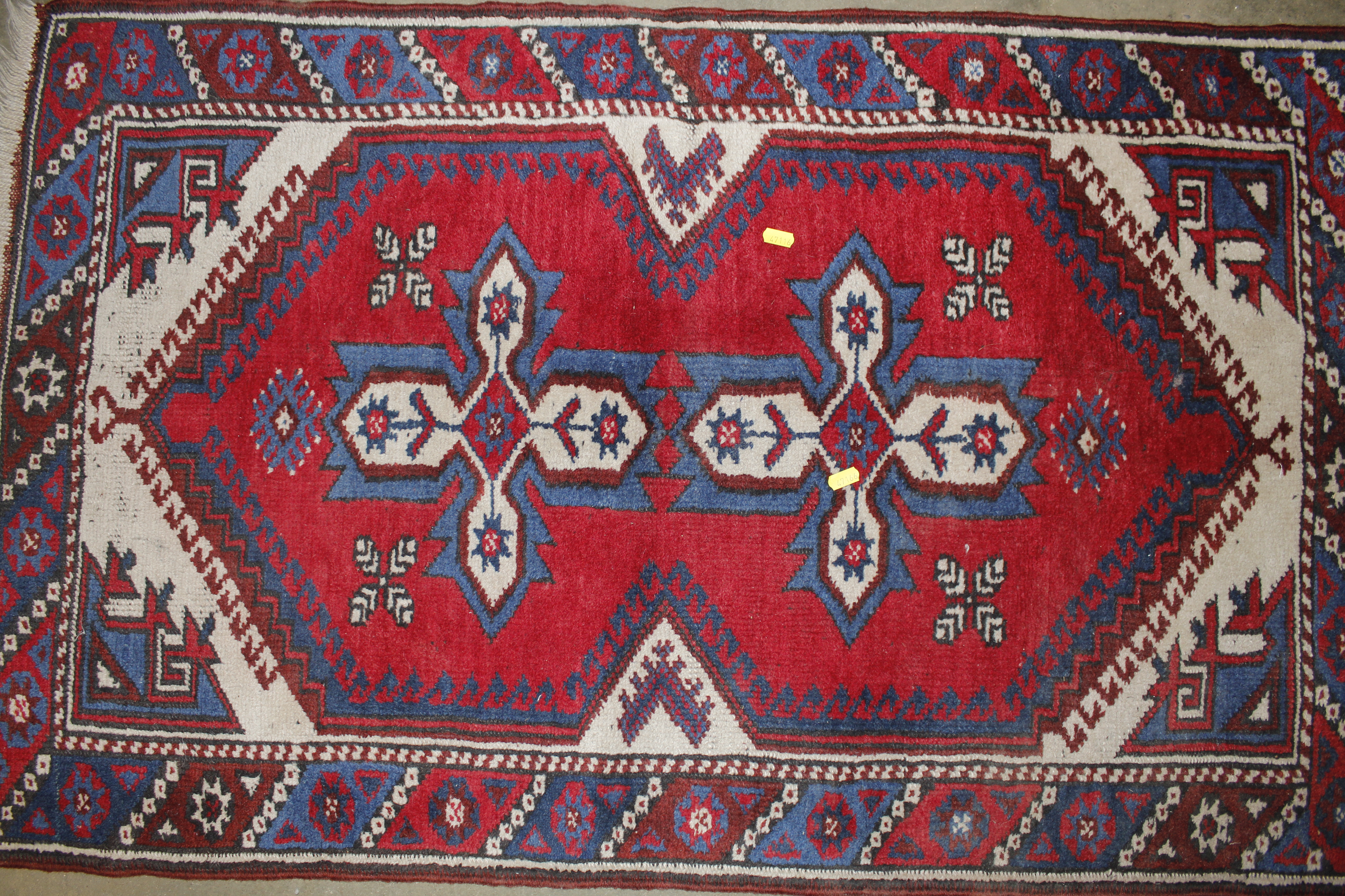 An approx. 4'2" x 2'5" red and blue patterned rug - Image 2 of 3