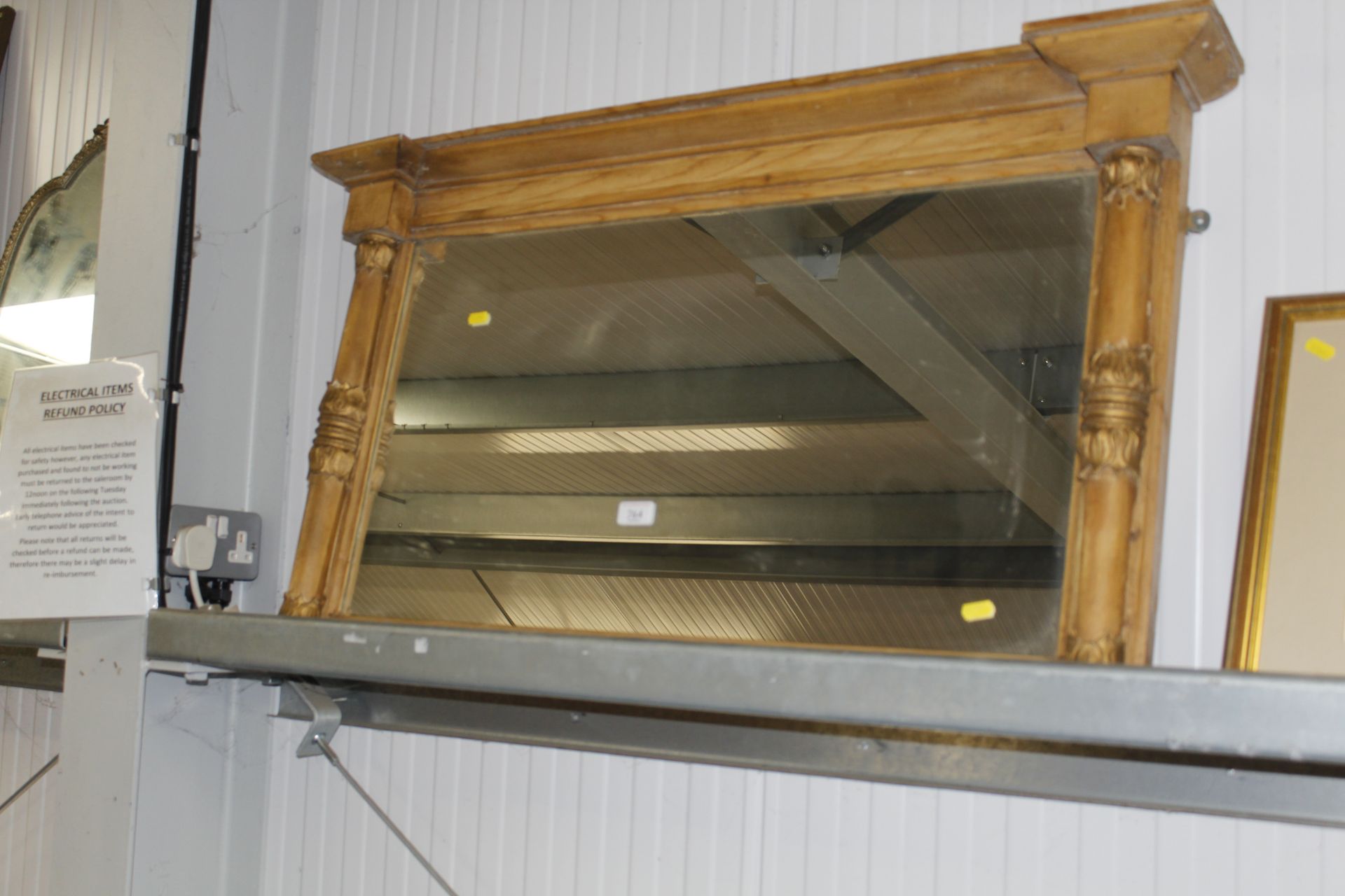 A stripped pine framed overmantel mirror