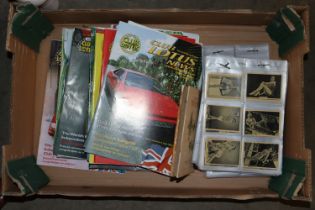 A box of Club Lotus magazines and cigarette cards