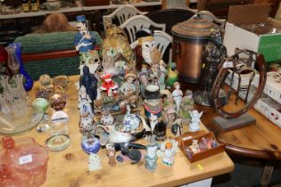 A collection of various ornaments; Toby jug etc