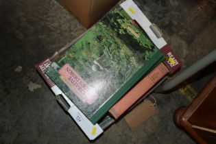 A box of various gardening books