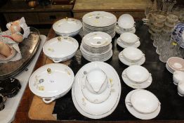 A quantity of Arabia floral decorated dinnerware