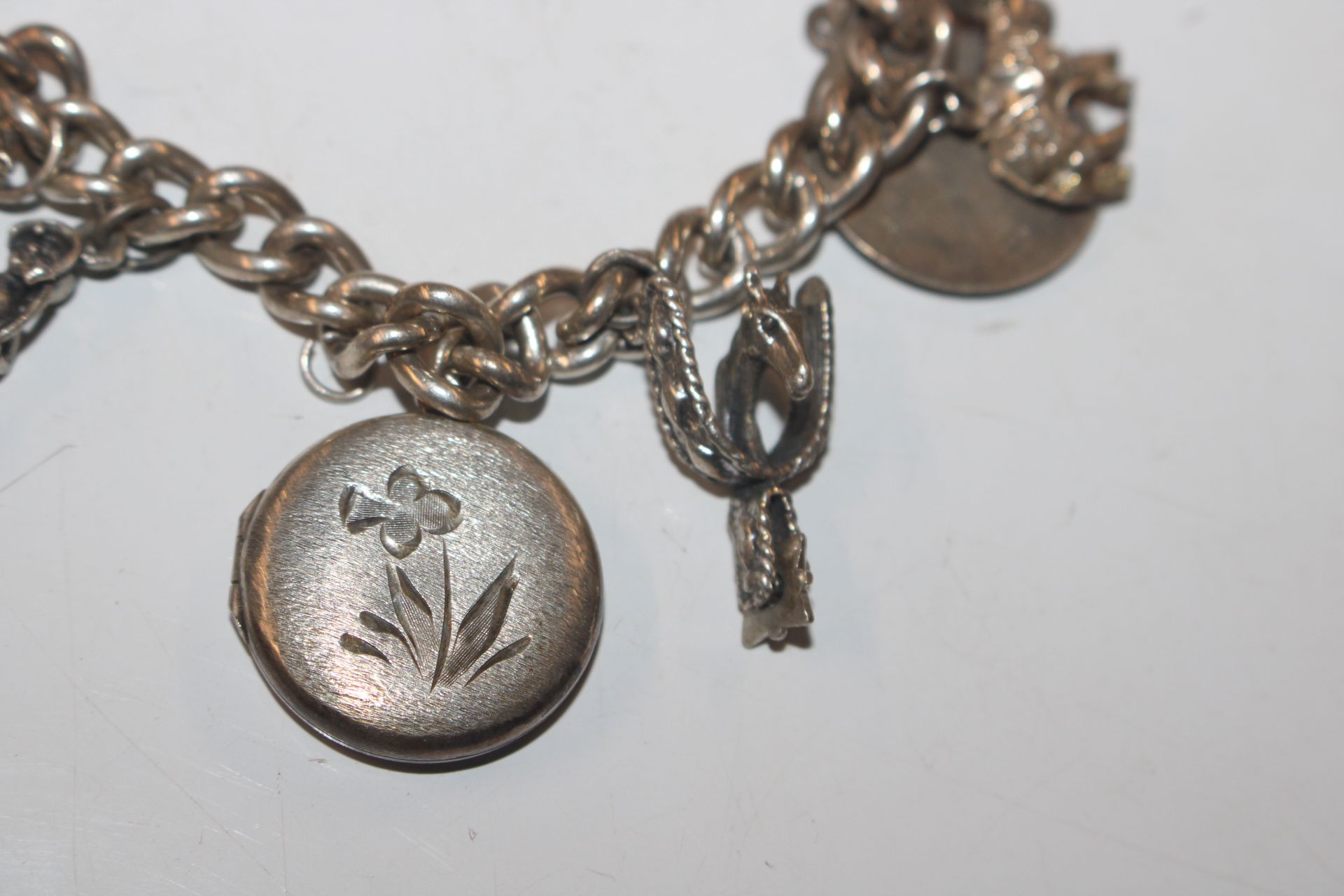 A silver charm bracelet; another charm bracelet an - Image 15 of 20
