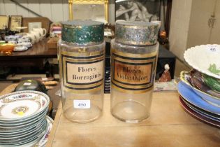 Two glass storage jars