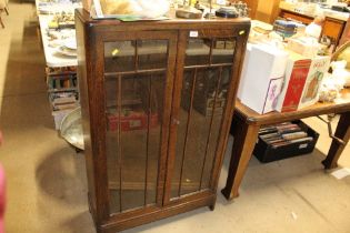 A 1930's oak glass fronted bookcase