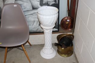 A white glazed jardinière on pedestal base