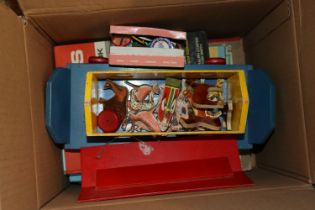 A box containing children's books, a Noah's ark and a quantity of badges