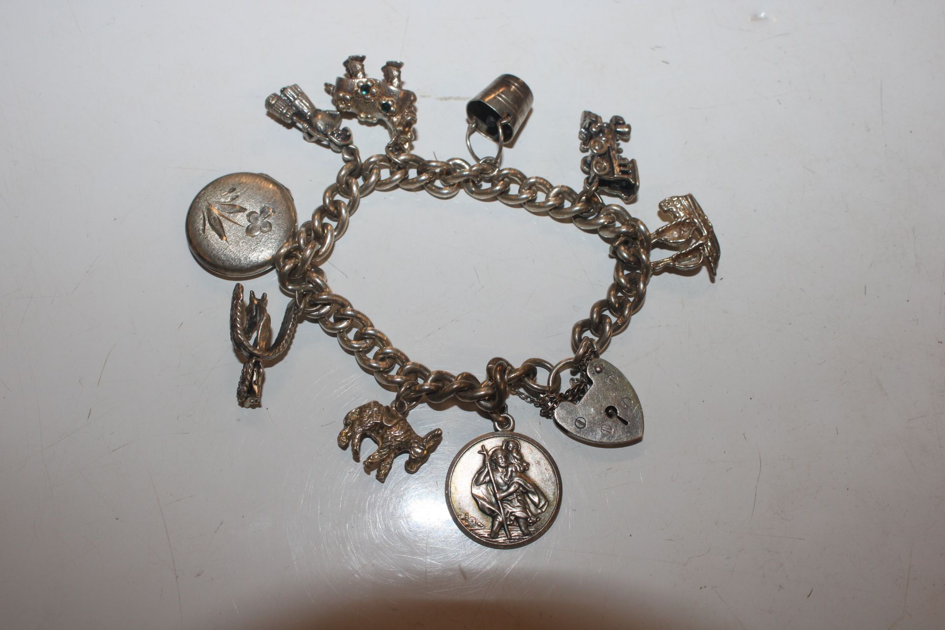 A silver charm bracelet; another charm bracelet an - Image 10 of 20