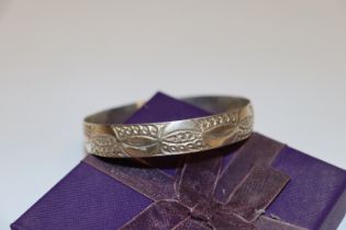 A sterling silver full bangle, approx. 22gms