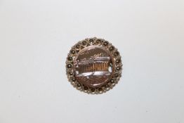 An antique Grand Tour sterling silver brooch with