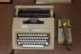 An Olivetti Lettera 25 portable typewriter; and a