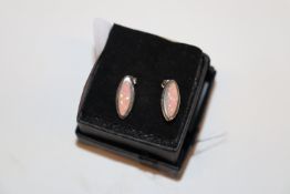 A pair of sterling silver and pink opal ear-rings