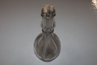 A glass four section decanter