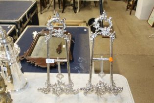 A pair of silver plated easels