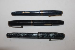 Three Conway Stewart fountain pens with 14ct gold