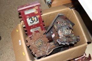 A box containing miscellaneous cuckoo clocks, desk