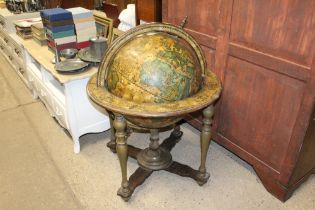 A large world globe on stand