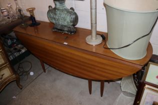 A teak drop leaf dining table, approx. length 163c