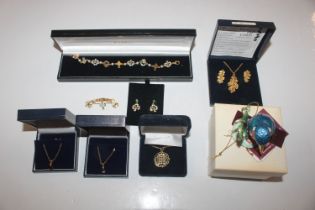 A box of costume jewellery to include a bracelet w