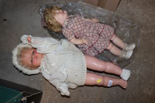 Two vintage dressed plastic dolls