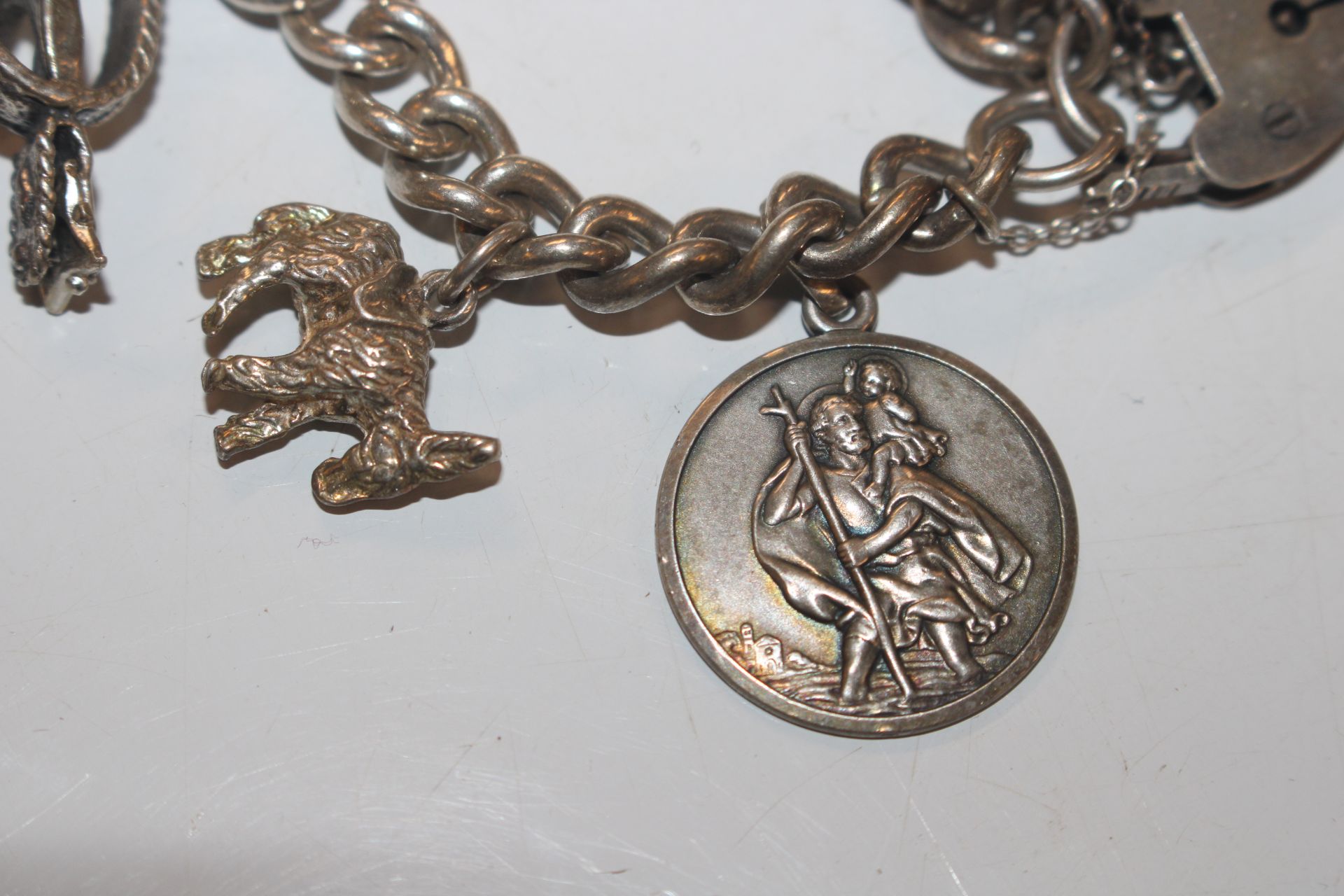 A silver charm bracelet; another charm bracelet an - Image 13 of 20