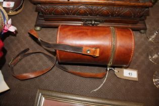 A leather cased three section spirit flask