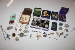 A box of costume jewellery mainly brooches