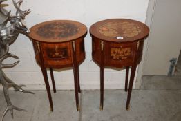 A pair of inlaid oval two tier occasional tables