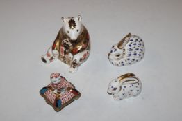 A Royal Crown Derby paperweight in the form of a b