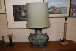 A bronzed Oriental archaic style table lamp and shade