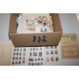 A box of loose stamps; stock books etc