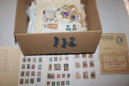 A box of loose stamps; stock books etc