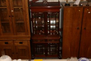 An early 20th Century glazed mahogany cabinet AF