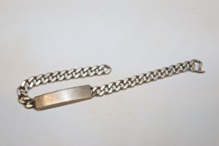 A vintage solid sterling silver ID bracelet with v