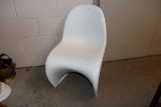 A Vitra white plastic chair