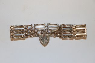 A hallmarked sterling silver five bar gate link bracelet with padlock clasp, approx. 16.5gms