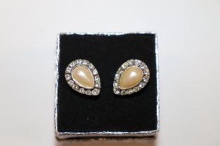 A pair of silver, pearl and diamanté ear-rings