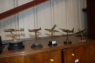 Five period cast brass WWII model aeroplanes on bases