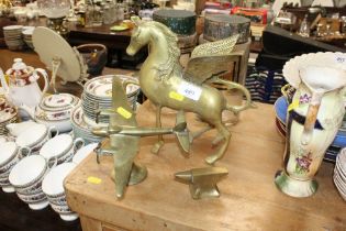 A brass Pegasus; a brass plane and miniature anvil