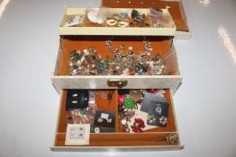 A jewellery box with contents of various costume j