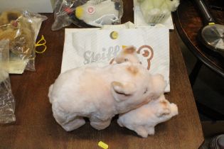Two Steiff pigs with Steiff paper bag
