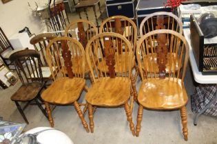 A set of six elm seated and backed stick back chai