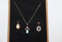 A 9ct gold opal pendant; similar blue topaz and di