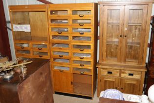 A vintage golden oak haberdashery cabinet