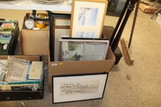 A box containing various pictures and prints