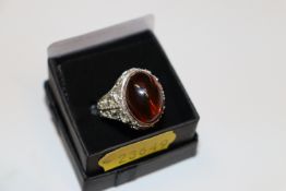 A large one size sterling silver and treacle amber