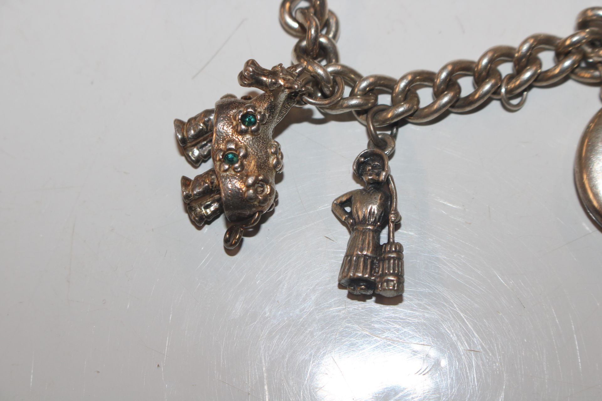 A silver charm bracelet; another charm bracelet an - Image 17 of 20