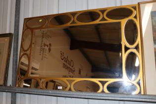 A large decorative gilt framed wall mirror with se