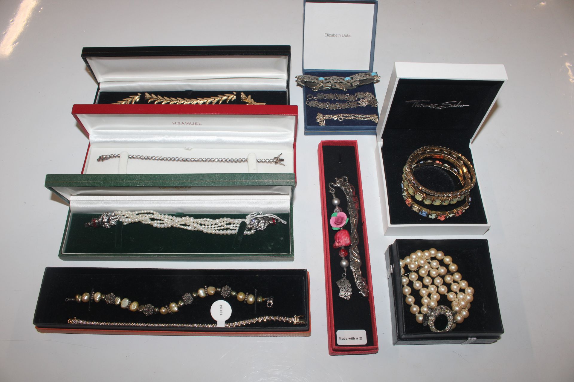A collection of 925 silver and other bracelets