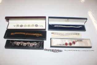 A box of 925 silver and other bracelets